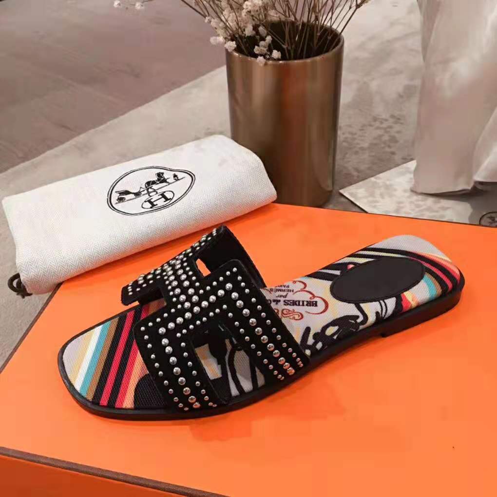 Hermes Women Oran Sandal in Suede Goatskin with Palladium Plated Studs and Iconic "H" Cut-Out-Black - Image 9
