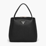 Prada Women Medium Leather handbag with the Prada Metal Lettering Logo Illuminating Its Center