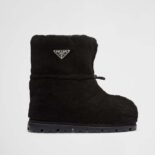 Prada Women Shearling Booties with Enameled Metal Triangle Logo-Black
