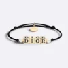 Dior Women D-Dice Bracelet Black Cotton and Lacquer with Gold-Finish Metal and White Resin Pearls 5 Dior Women D-Dice Bracelet Black Cotton and Lacquer with Gold-Finish Metal and White Resin Pearls