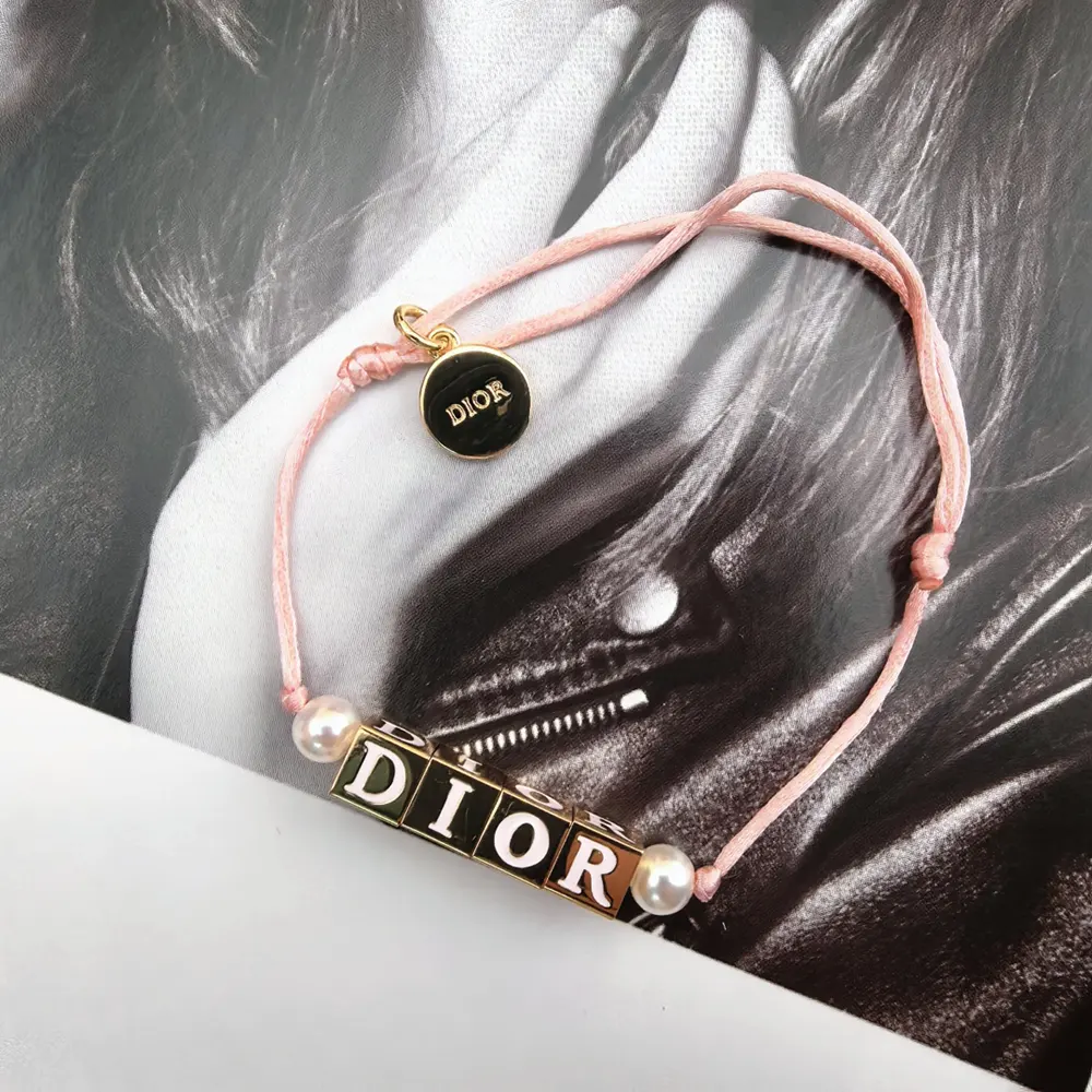 Dior Women D-Dice Bracelet Pale Pink Cotton and Lacquer with Gold-Finish Metal and White Resin Pearls 3 Dior Women D-Dice Bracelet Pale Pink Cotton and Lacquer with Gold-Finish Metal and White Resin Pearls