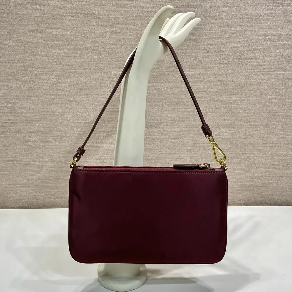 Prada Women Re-Nylon Pouch Enameled Metal Triangle Logo 1NE545 3 Prada Women Re-Nylon Pouch Enameled Metal Triangle Logo 1NE545