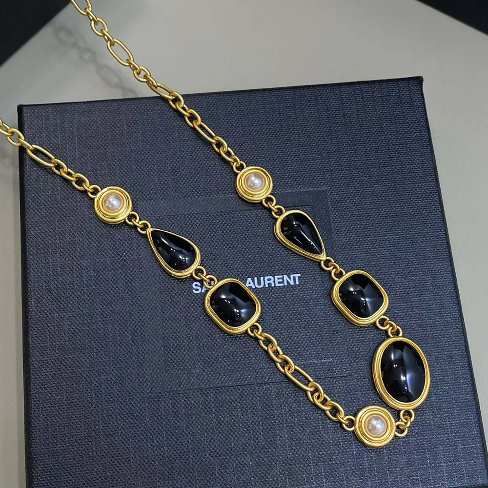 Saint Laurent YSL Women Cassandre Necklace in Enamel Resin and Metal 4 Saint Laurent YSL Women Cassandre Necklace in Enamel Resin And Metal